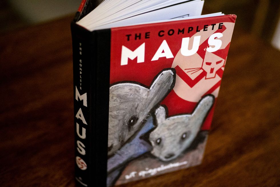 this photo taken in los angeles, california on january 27, 2022 shows the cover of the graphic novel maus by art spiegelman   a school board in tennessee has added to a surge in book bans by conservatives with an order to remove the award winning 1986 graphic novel on the holocaust, maus, from local student libraries author art spiegelman told cnn on january 27    coincidentally international holocaust remembrance day    that the ban of his book for crude language was myopic and represents a bigger and stupider problem than any with his specific work   restricted to editorial use   mandatory mention of the artist upon publication   to illustrate the event as specified in the caption photo by maro siranosian  afp  restricted to editorial use   mandatory mention of the artist upon publication   to illustrate the event as specified in the caption  restricted to editorial use   mandatory mention of the artist upon publication   to illustrate the event as specified in the caption photo by maro siranosianafp via getty images