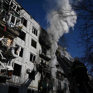 firefighters work on a fire on a building after bombings on the eastern ukraine town of chuguiv on february 24, 2022, as russian armed forces are trying to invade ukraine from several directions, using rocket systems and helicopters to attack ukrainian position in the south, the border guard service said   russias ground forces on thursday crossed into ukraine from several directions, ukraines border guard service said, hours after president vladimir putin announced the launch of a major offensive russian tanks and other heavy equipment crossed the frontier in several northern regions, as well as from the kremlin annexed peninsula of crimea in the south, the agency said photo by aris messinis  afp photo by aris messinisafp via getty images