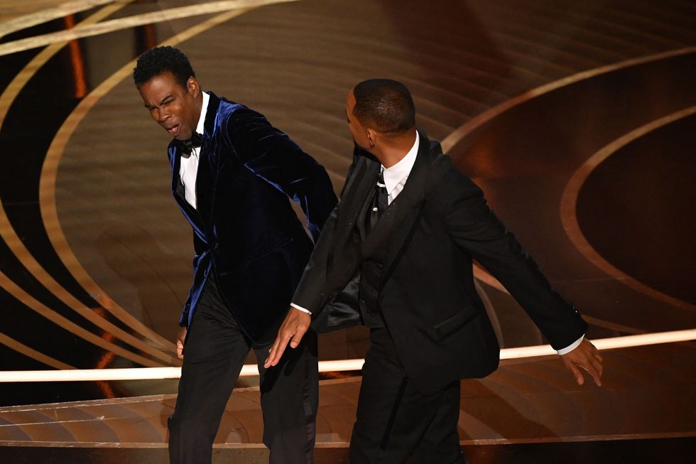 topshot   us actor will smith r slaps us actor chris rock onstage during the 94th oscars at the dolby theatre in hollywood, california on march 27, 2022 photo by robyn beck  afp photo by robyn beckafp via getty images