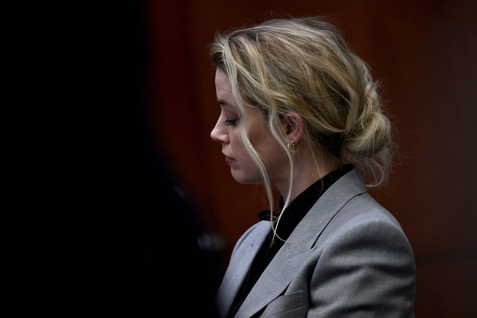 us actress amber heard listens during the $50 million depp vs heard defamation trial at the fairfax county circuit court in fairfax, virginia, on april 12, 2022 photo by brendan smialowski  pool  afp photo by brendan smialowskipoolafp via getty images