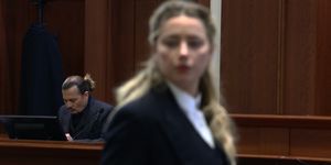 topshot   us actress amber heard r speaks to her legal team as us actor johhny depp l returns to the stand after a lunch recess during the 50 million us dollar depp vs heard defamation trial at the fairfax county circuit court in fairfax, virginia, april 21, 2022   actor johnny depp is suing ex wife amber heard for libel after she wrote an op ed piece in the washington post in 2018 referring to herself as a public figure representing domestic abuse photo by jim lo scalzo  pool  afp photo by jim lo scalzopoolafp via getty images