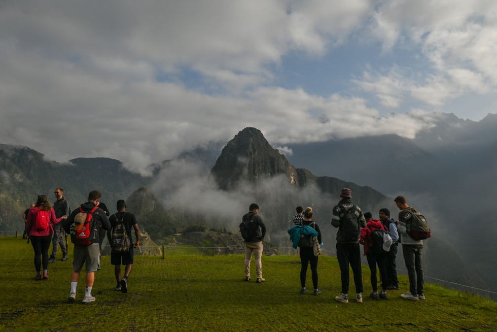 tourists explore the ancient inca city of machu picchu located in the andes at an altitude of 2,430 meters 7,970 feet the most famous icon of the inca civilization was declared a peruvian historical sanctuary in 1981, a unesco world heritage site in 1983, and in 2007 was then declared one of the seven new wonders of the world on wednesday, 20 april 2022, in historic sanctuary of machu picchu, urubamba province, peru photo by artur widaknurphoto via getty images