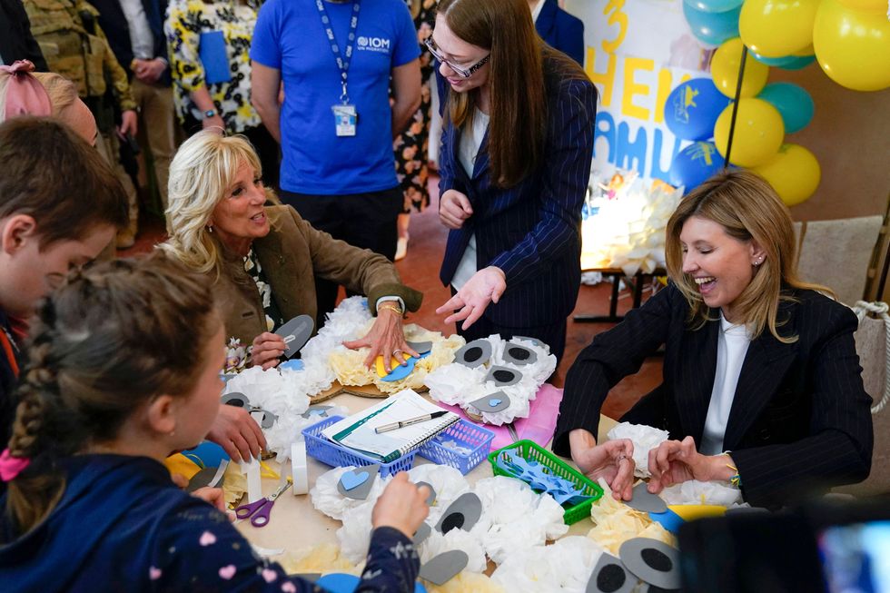 olena zelenska and ﻿us first lady jill biden join a group of children making tissue paper bears for mothers day gifts at school 6, a public school that has taken in displaced students in uzhhorod on may 8, 2022