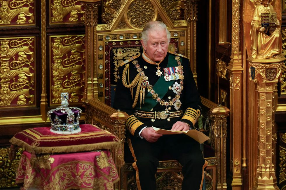 london, england may 10 prince charles, prince of wales reads the queens speech next to her imperial state crown in the house of lords chamber, during the state opening of parliament in the house of lords at the palace of westminster on may 10, 2022 in london, england the state opening of parliament formally marks the beginning of the new session of parliament it includes queens speech, prepared for her to read from the throne, by her government outlining its plans for new laws being brought forward in the coming parliamentary year this year the speech will be read by the prince of wales as hm the queen will miss the event due to ongoing mobility issues photo by alastair grant wpa poolgetty images