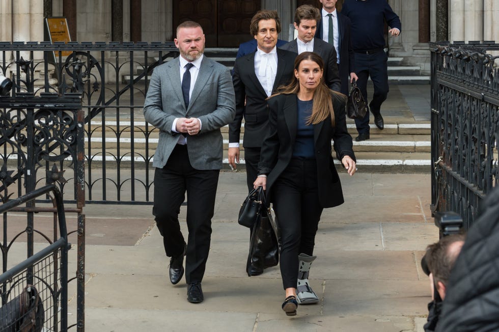 london, united kingdom may 10, 2022 coleen rooney r and former england footballer wayne rooney l leave the royal courts of justice on the first day of the hearing on the libel case of rebekah vardy against coleen rooney after the latter accused her of leaking private stories to the press on may 10, 2022 in london, england photo credit should read wiktor szymanowiczfuture publishing via getty images