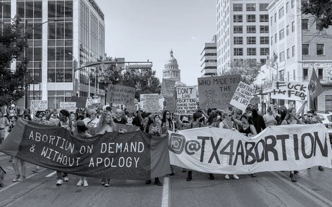 abortion rights demonstrators march near the state capitol in austin, texas