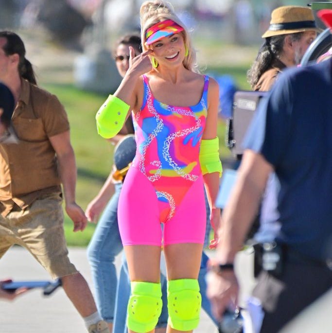 margot robbie and ryan gosling on rollerblades film new scenes for barbie movie