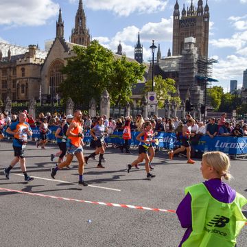 london, united kingdom 20221002 runners pass through parliament square past the houses of parliament during the 2022 london marathon photo by vuk valcicsopa imageslightrocket via getty images
