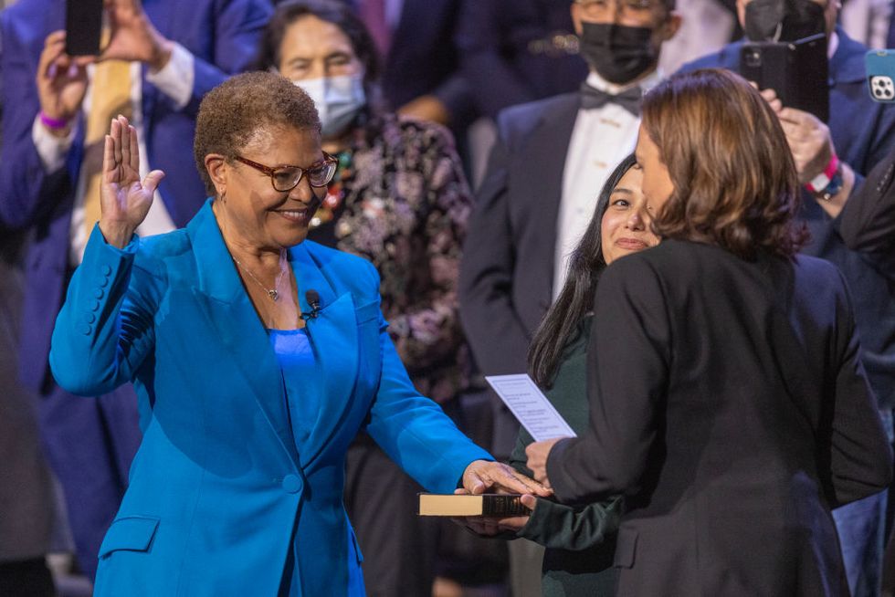 los angeles, ca december 11 vice president kamala harris, the first woman of color to hold the office, administers the oath of office to karen bass, the first woman of color to serve as mayor of los angeles, on december 11, 2022 in los angeles, california as rep karen bass becomes mayor, black people will be leading the four largest cities in america bass has pledged to immediately address the citys homelessness crisis by declaring a state of emergency on day one photo by david mcnewgetty images