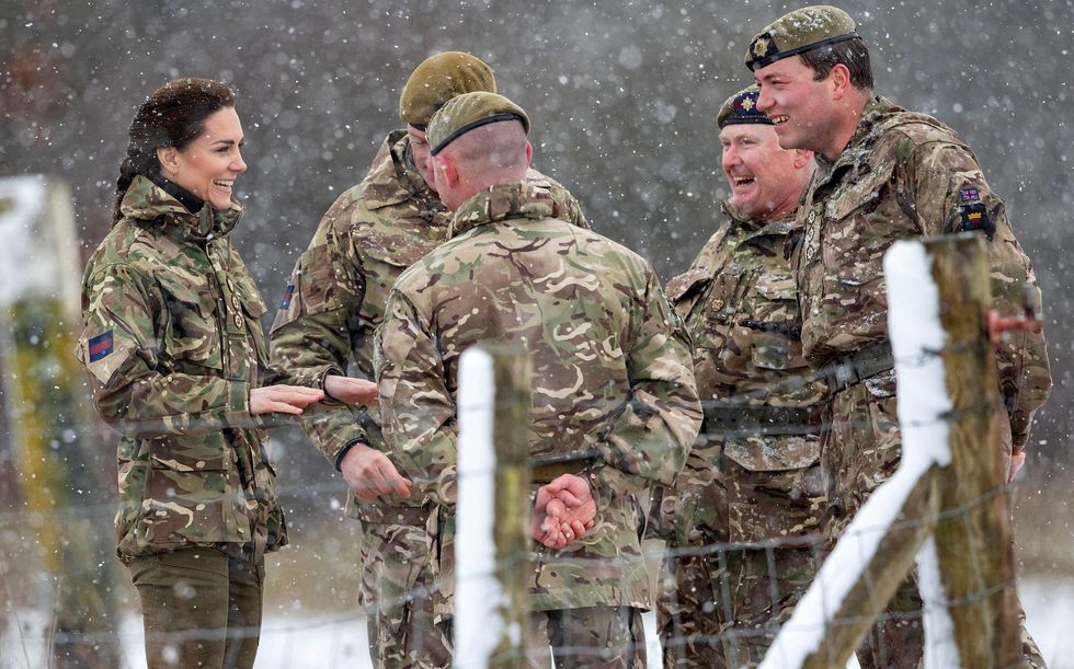 britains catherine, princess of wales l reacts as she walks in the snow while meeting members of the 1st battalion irish guards during her visit to the salisbury plain training area, near salisbury, southern england, on march 8, 2023 photo by steve reigate pool afp photo by steve reigatepoolafp via getty images