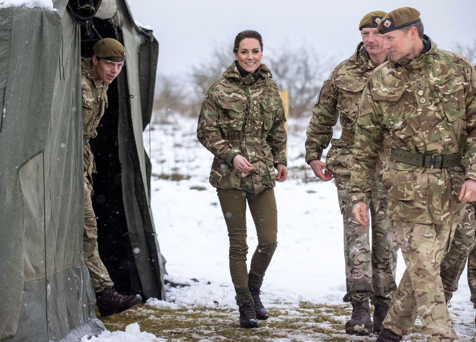 britains catherine, princess of wales c reacts as she walks in the snow while meeting members of the 1st battalion irish guards during her visit to the salisbury plain training area, near salisbury, southern england, on march 8, 2023 photo by steve reigate pool afp photo by steve reigatepoolafp via getty images