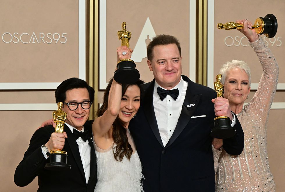 best actor in a supporting role us vietnamese actor ke huy quan l, best actress in a leading role malaysian actress michelle yeoh 2nd l, best actress in a supporting role us actress jamie lee curtis r for everything everywhere all at once, and best actor in a leading role us actor brendan fraser c for the whale pose with their oscar trophies in the press room during the 95th annual academy awards at the dolby theatre in hollywood, california on march 12, 2023 photo by frederic j brown afp photo by frederic j brownafp via getty images