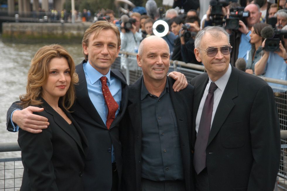 actor daniel craig centre left, being presented to the press  at st cathariness dock as the new james bond alongside director martin campbell centre, right and producers barbara boccoli, michael g wilson, london, 14 october 2005 photo by phil dentredferns