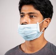 man wearing mask over mouth but not nose