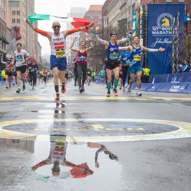 boston, ma, usa april 17 runners celebrate at the finish line at the boston marathon 2023 on april 17, 2023 in boston, massachusetts, united states photo by lauren owens lambertanadolu agency via getty images