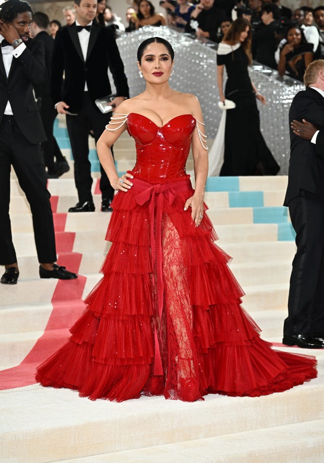 Salma Hayek Wore Red Bustier Gown With Sheer Lace Leg Slit to 2023 Met Gala