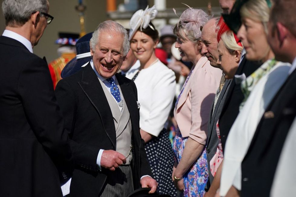 britains king charles iii meets with guests during the garden party at buckingham palace, in london, on may 3, 2023 to celebrate his and his wife britains camilla, queen consort coronation ceremony as king and queen of the united kingdom and commonwealth realm nations, on may 6, 2023 photo by yui mok pool afp photo by yui mokpoolafp via getty images