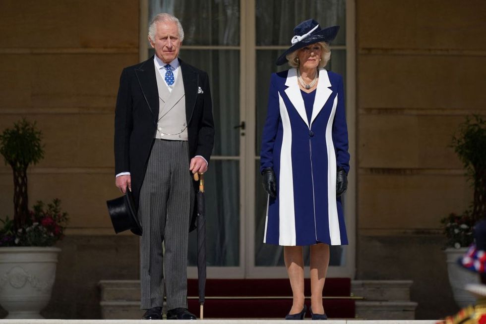 britains king charles iii and britains camilla, queen consort arrive to meet the guests attending the garden party at buckingham palace, in london, on may 3, 2023 to celebrate their coronation ceremony as king and queen of the united kingdom and commonwealth realm nations, on may 6, 2023 photo by yui mok pool afp photo by yui mokpoolafp via getty images