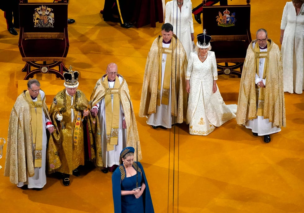 britains camilla r wearing a modified version of queen marys crown walks behind britains king charles iii wearing the st edwards crown on his head during the coronation ceremony inside westminster abbey in central london on may 6, 2023 the set piece coronation is the first in britain in 70 years, and only the second in history to be televised charles will be the 40th reigning monarch to be crowned at the central london church since king william i in 1066 outside the uk, he is also king of 14 other commonwealth countries, including australia, canada and new zealand camilla, his second wife, will be crowned queen alongside him and be known as queen camilla after the ceremony photo by andrew matthews pool afp photo by andrew matthewspoolafp via getty images