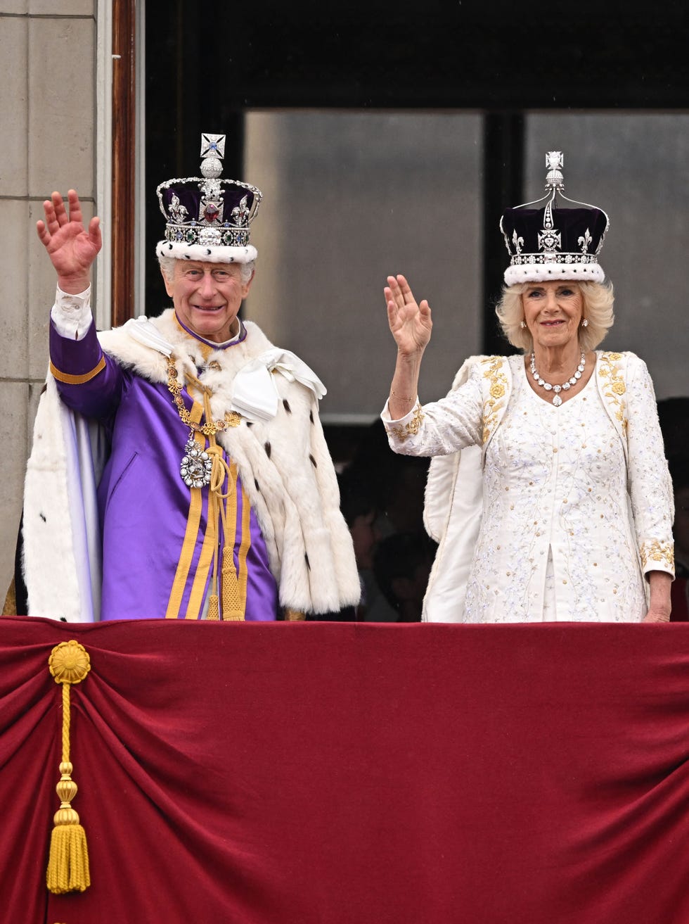 britains king charles iii wearing the imperial state crown, and britains queen camilla wearing a modified version of queen marys crown wave from the buckingham palace balcony after viewing the royal air force fly past in central london on may 6, 2023, after their coronations the set piece coronation is the first in britain in 70 years, and only the second in history to be televised charles will be the 40th reigning monarch to be crowned at the central london church since king william i in 1066 photo by oli scarff afp photo by oli scarffafp via getty images