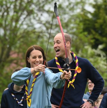 london, england may 08 watched by prince william, prince of wales, catherine, princess of wales, tries her hand at archery while taking part in the big help out, during a visit to the 3rd upton scouts hut in slough on may 8, 2023 in london, england the big help out is a day when people are encouraged to volunteer in their communities it is part of the celebrations of the coronation of charles iii and his wife, camilla, as king and queen of the united kingdom of great britain and northern ireland, and the other commonwealth realms that took place at westminster abbey on saturday, may 6, 2023 photo by daniel leal wpa poolgetty images