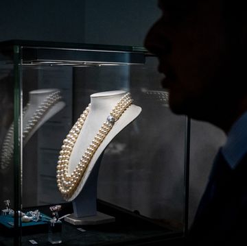 this photograph taken on may 8, 2023, shows christies international head of jewellery rahul kadakia silhouetted next to a natural and cultured pearl and coloured diamond by harry winston expected to fetch at least 72 million usd at the world of heidi horten sale in geneva christies launch the sale of hundreds of jewels that belonged to austrian billionaire heidi horten, whose german businessman husband made his fortune under the nazis the whole collection has an estimated value of more than $150 million photo by fabrice coffrini afp photo by fabrice coffriniafp via getty images