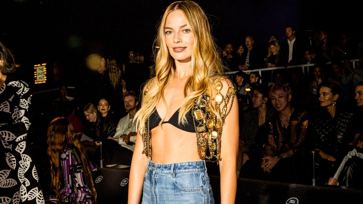 Margot Robbie paired lingerie with jeans at the Chanel show in Los