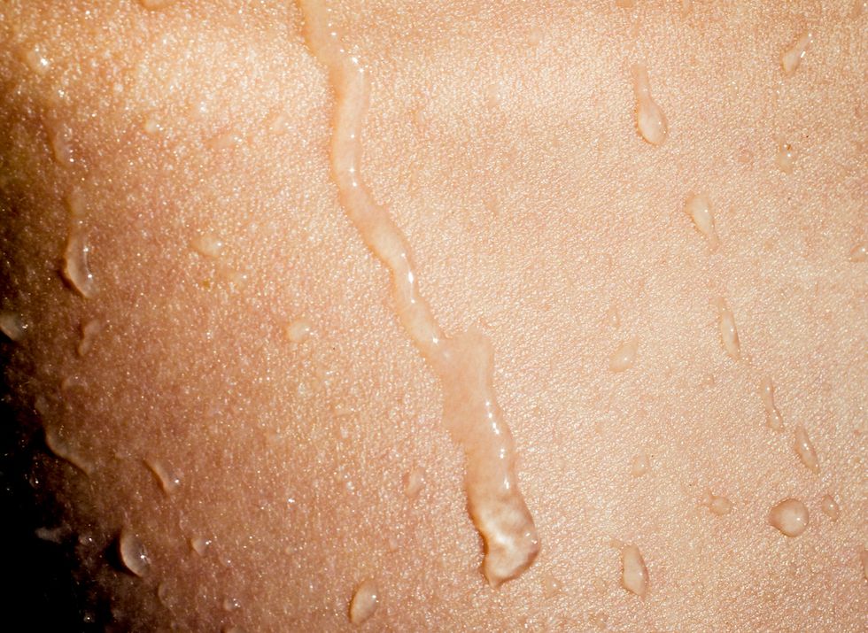 sensual image of wet skin closeup, wet body, tan skin