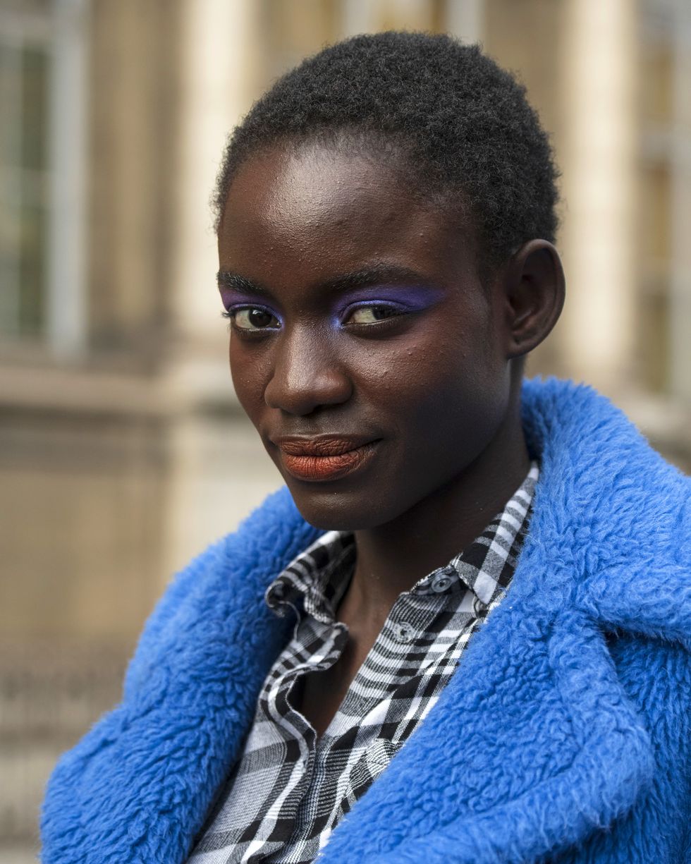 paris, france   february 29 a model wears purple eyeshadow and red lipstick on february 29, 2020 in paris, france photo by kirstin sinclairgetty images