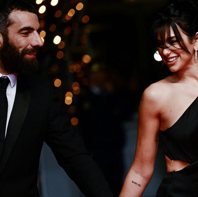 topshot french director romain gavras l and british singer and model dua lipa arrive for the screening of the film omar la fraise the king of algiers during the 76th edition of the cannes film festival in cannes, southern france, on may 20, 2023 photo by loic venance afp photo by loic venanceafp via getty images