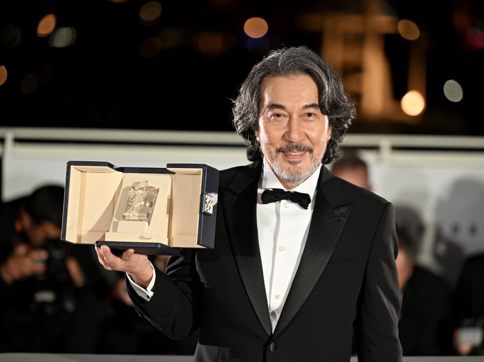 cannes, france may 27 japanese actor koji yakusho poses during a photocall with his trophy after winning the best actor prize for his part in the film perfect days during the closing ceremony of the 76th cannes film festival at palais des festivals in cannes, france on may 27, 2023 photo by mustafa yalcinanadolu agency via getty images
