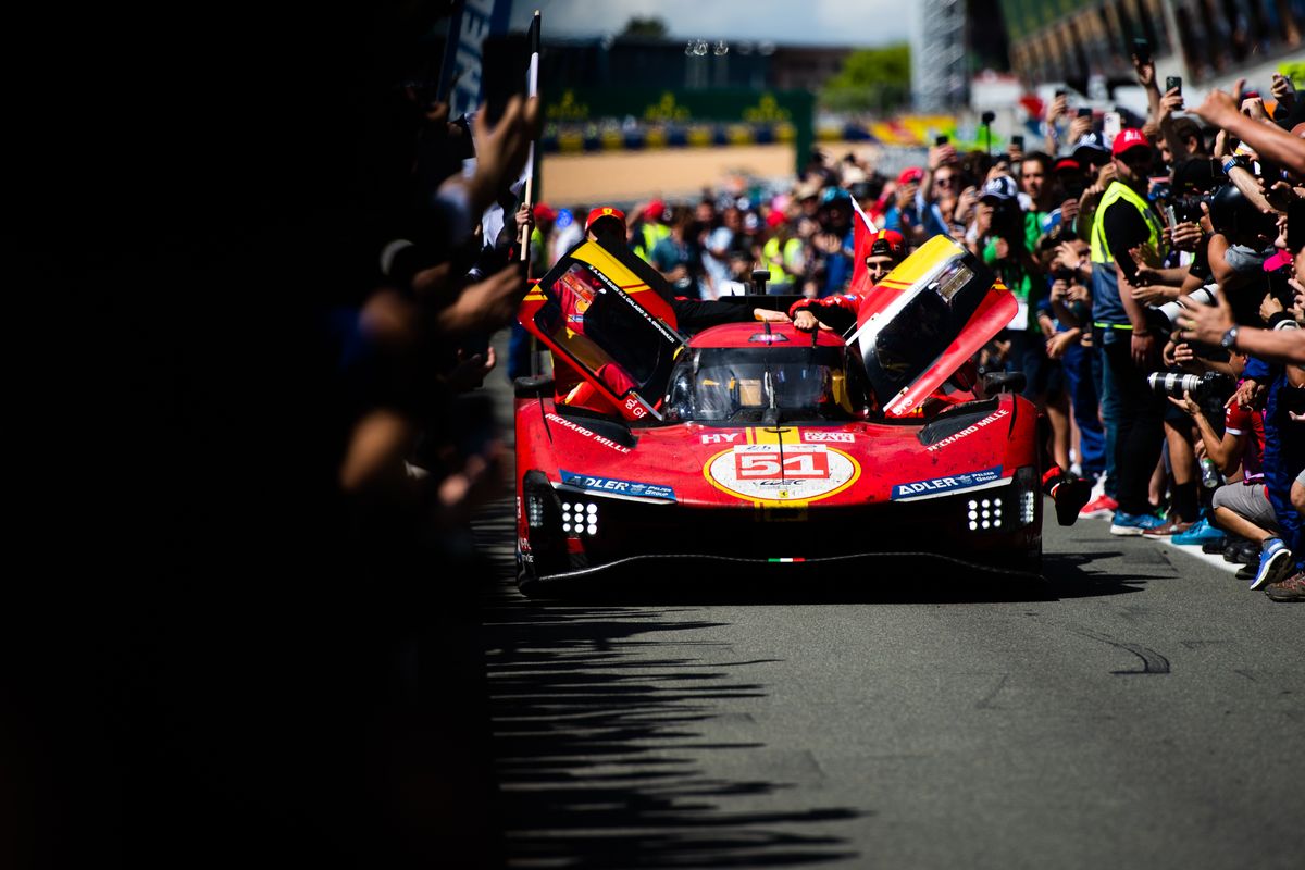 le mans, france june 11 race winners, the 51 af corse ferrari 499p of james calado, alessandro pier guidi, and antonio giovinazzi arrive down the pit lane towards parc ferme at the end of the 100th anniversary of the 24 hours of le mans at the circuit de la sarthe on june 11, 2023 in le mans, france photo by james moy photographygetty images