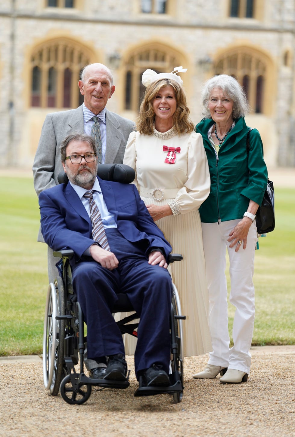 Kate Garraway opts for a white dress to receive her royal honour