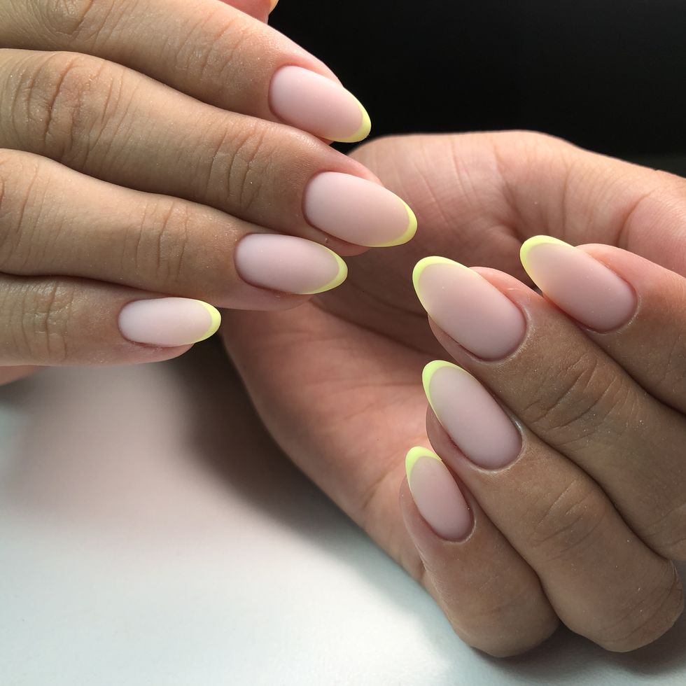 french manicure on the nailsmanicure gel nail polish spa and manicure concept female hands with french manicure
