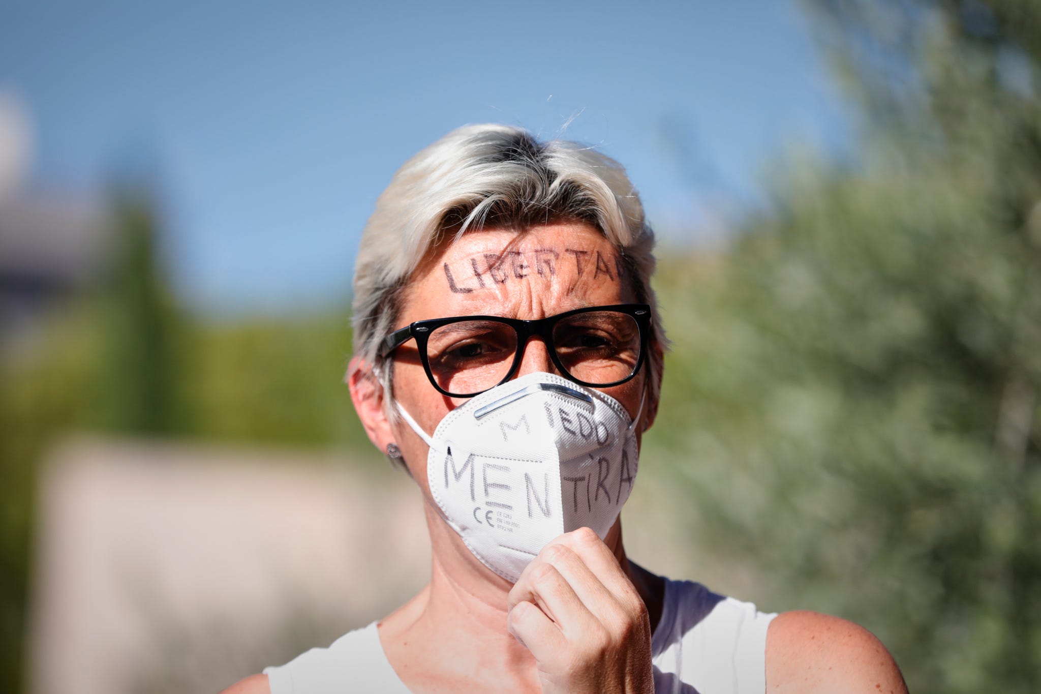 madrid, spain   august 16  attendees participate in the manifestation against the mandatory use of masks in madrids plaza de colón, on august 16, 2020 in madrid, spain photo by jesus hellin europa press via getty images