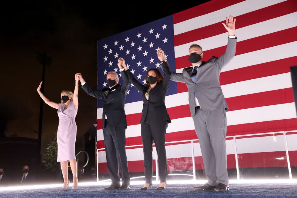 wilmington, delaware   august 20 democratic presidential nominee joe biden, his wife dr jill biden, democratic vice presidential nominee kamala harris and her husband douglas emhoff raise their arms on stage outside the chase center after biden delivered his acceptance speech on the fourth night of the democratic national convention from the chase center on august 20, 2020 in wilmington, delaware the convention, which was once expected to draw 50,000 people to milwaukee, wisconsin, is now taking place virtually due to the coronavirus pandemic photo by win mcnameegetty images