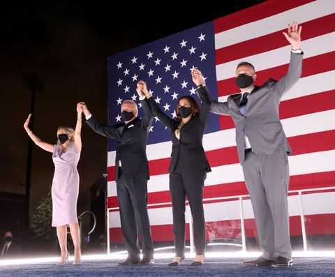 wilmington, delaware   august 20 democratic presidential nominee joe biden, his wife dr jill biden, democratic vice presidential nominee kamala harris and her husband douglas emhoff raise their arms on stage outside the chase center after biden delivered his acceptance speech on the fourth night of the democratic national convention from the chase center on august 20, 2020 in wilmington, delaware the convention, which was once expected to draw 50,000 people to milwaukee, wisconsin, is now taking place virtually due to the coronavirus pandemic photo by win mcnameegetty images