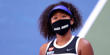 new york, new york   september 04 naomi osaka of japan wears a protective face mask with the name, ahmaud arbery stenciled on it after winning her women's singles third round match against marta kostyuk of the ukraine on day five of the 2020 us open at usta billie jean king national tennis center on september 04, 2020 in the queens borough of new york city ahmaud arbery, was an unarmed 25 year old african american man, was pursued and fatally shot while jogging in glynn county, georgia photo by al bellogetty images