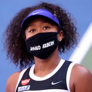 new york, new york   september 04 naomi osaka of japan wears a protective face mask with the name, ahmaud arbery stenciled on it after winning her women's singles third round match against marta kostyuk of the ukraine on day five of the 2020 us open at usta billie jean king national tennis center on september 04, 2020 in the queens borough of new york city ahmaud arbery, was an unarmed 25 year old african american man, was pursued and fatally shot while jogging in glynn county, georgia photo by al bellogetty images