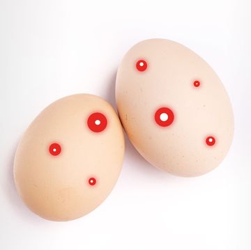 two eggs with red spots on them