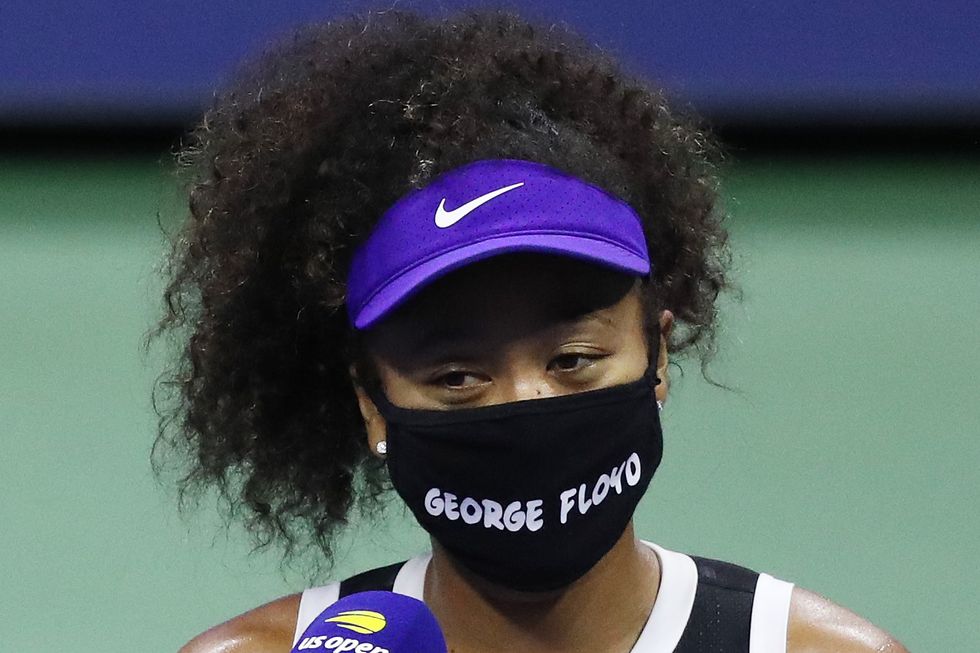 new york, new york   september 08 naomi osaka of japan wears a mask with the name of george floyd on it during an interview  following her women’s singles quarter finals match win against shelby rogers of the united states on day nine of the 2020 us open at the usta billie jean king national tennis center on september 8, 2020 in the queens borough of new york city photo by matthew stockmangetty images