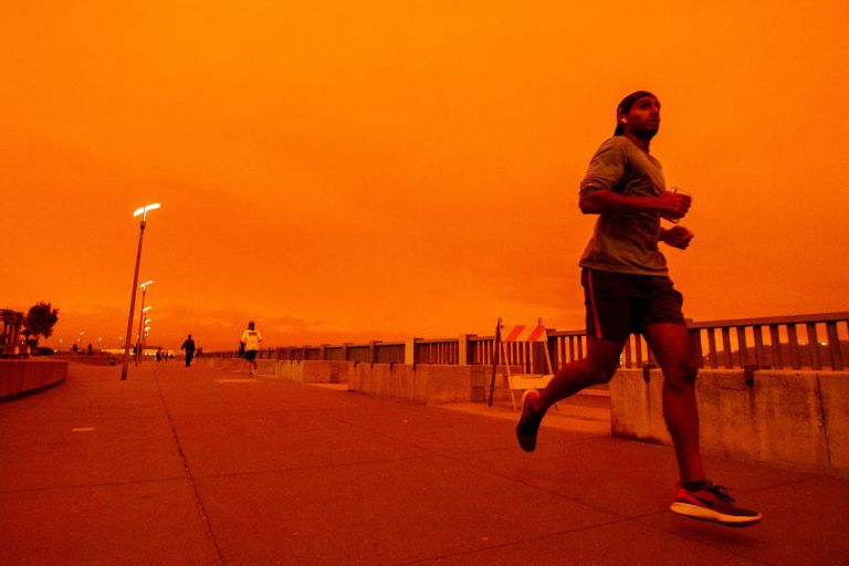 san francisco, ca   september 9 people jog along embarcadero as smoky skies from the northern california wildfires casts a reddish color during the morning in san francisco, calif, on wednesday, sept 9, 2020 photo by ray chavezmedianews groupthe mercury news via getty images