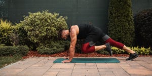 shot of a shirtless muscular young man doing strength exercise on yoga mat in the backyard