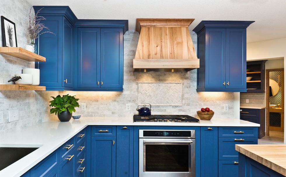 a kitchen with blue cabinets