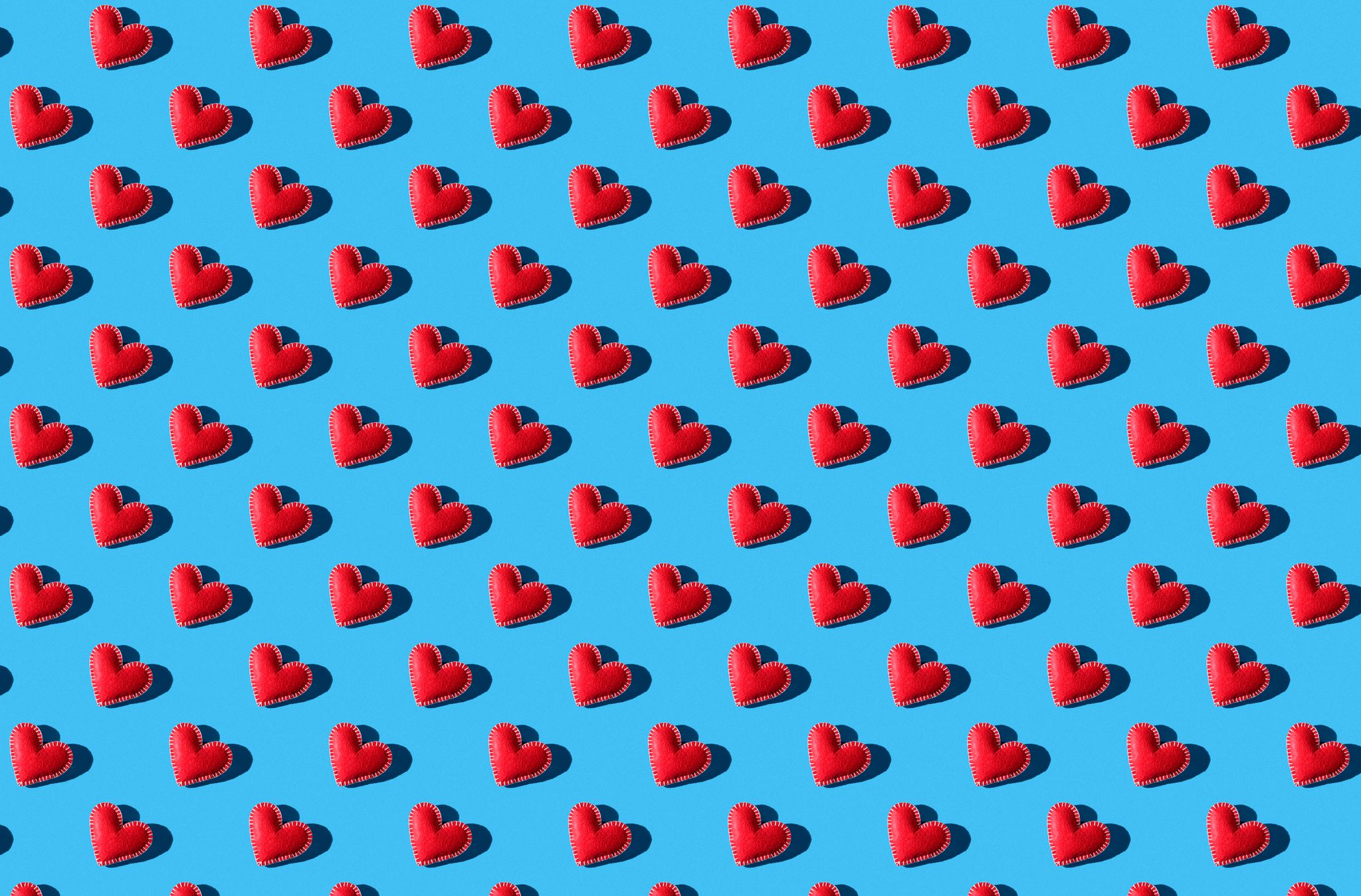 seamless pattern of red hearts on a blue background the background of valentines day handmade work