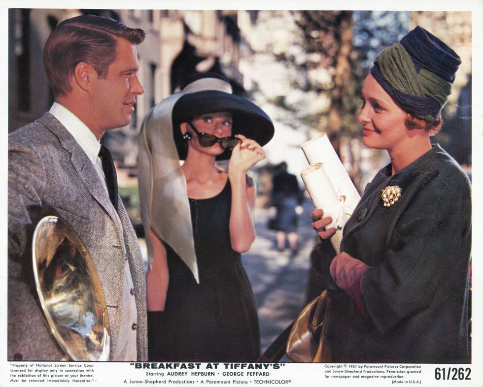 patricia neal converses with george peppard while audrey hepburn looks over her sunglasses in a scene from the film breakfast at tiffanys, 1961 photo by paramountgetty images