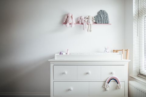 a modern baby girls nursery bedroom interior