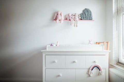 a modern baby girls nursery bedroom interior