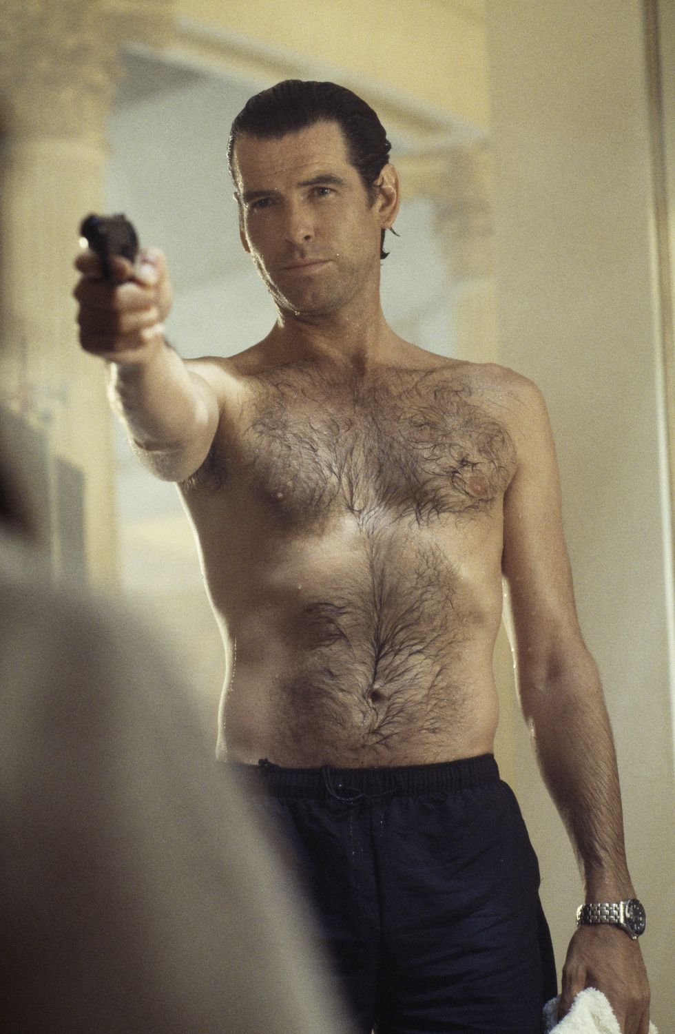 irish actor pierce brosnan as 007 in the james bond film 'goldeneye', 1995 here he confronts an assailant in a sauna photo by keith hamsheregetty images