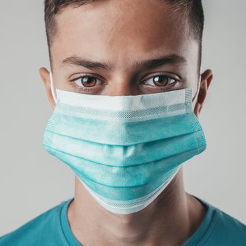portrait of a young boy with protective face mask